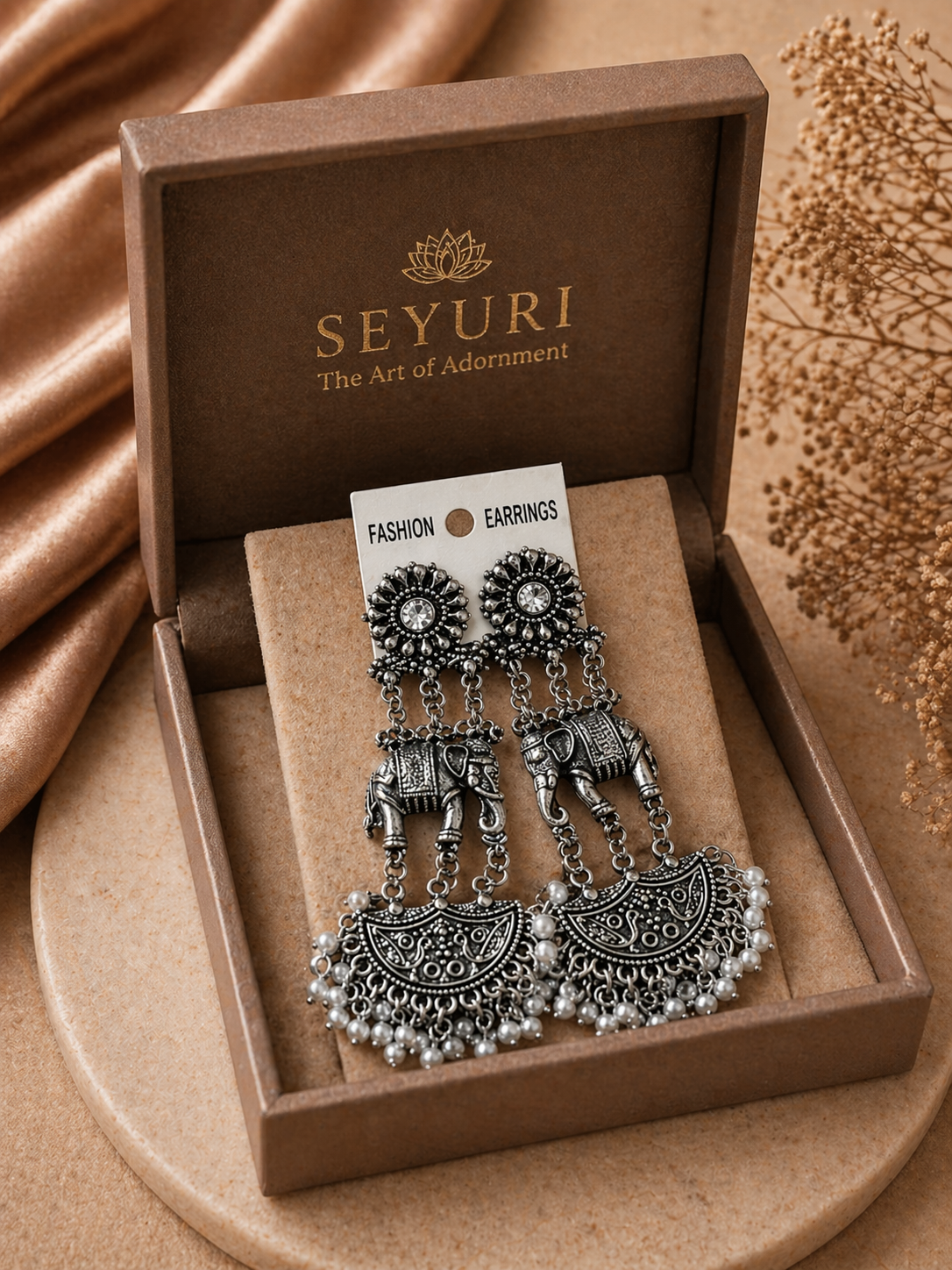 antique style elephant motif statement earrings
