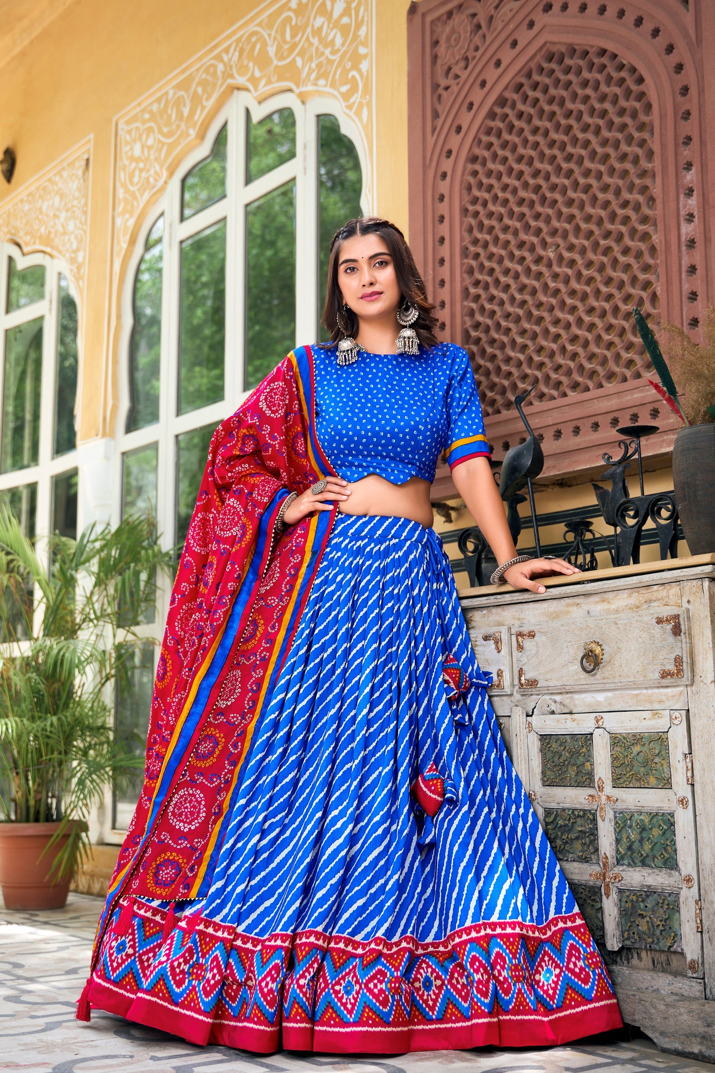 Artistic patola print detailing on blue silk lehenga