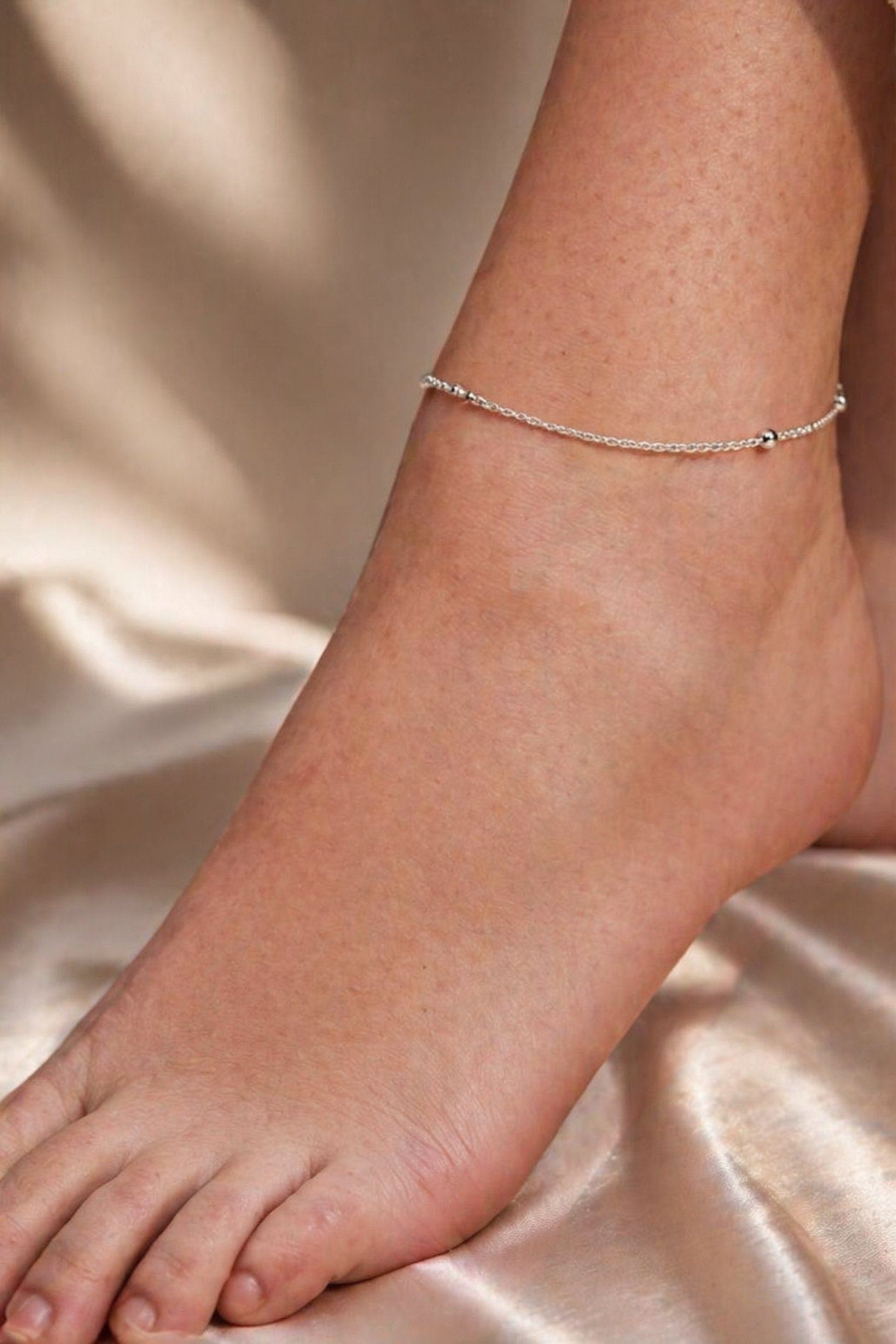 minimalist silver anklet with small beads

