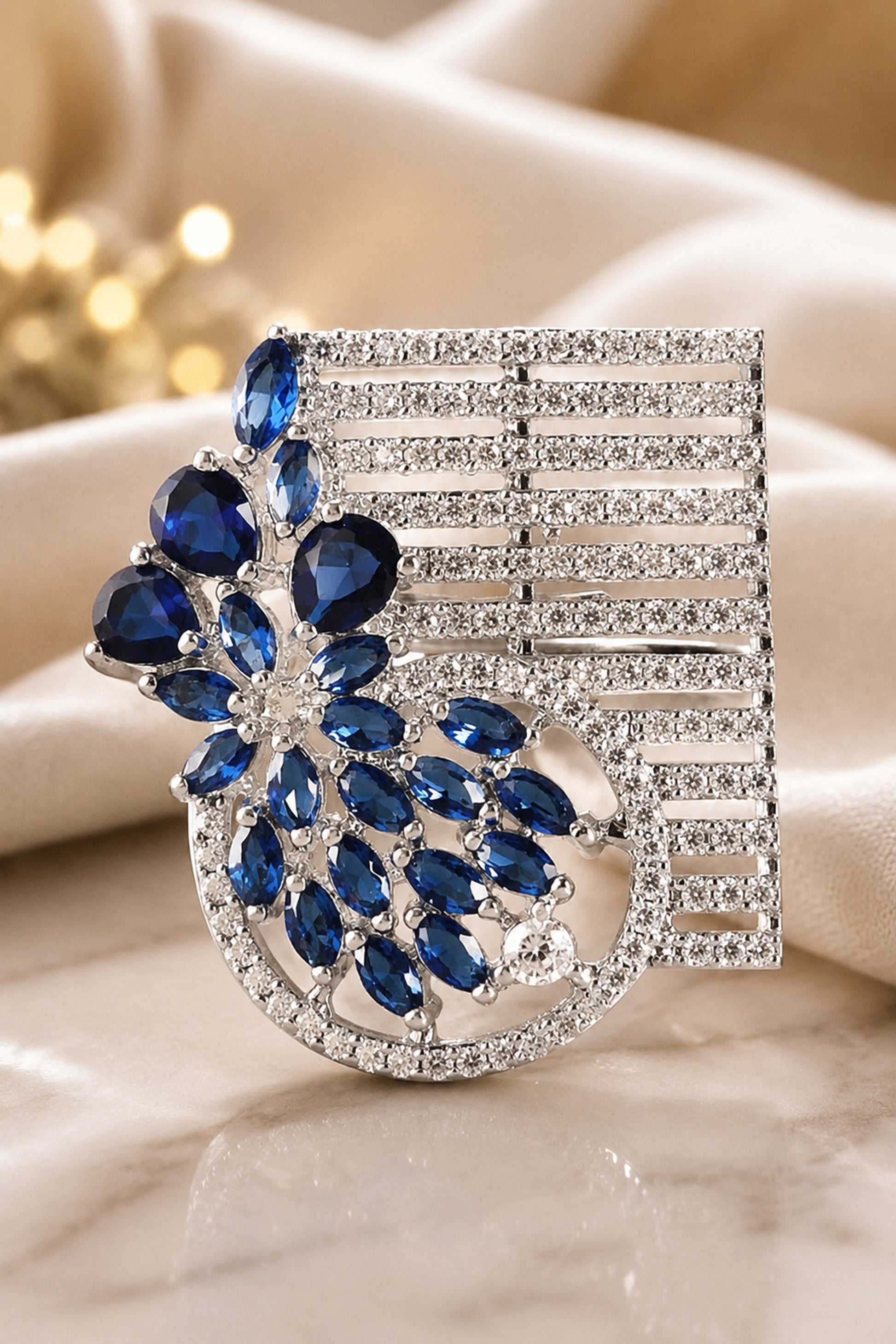 Fashion jewellery ring featuring layered floral structure