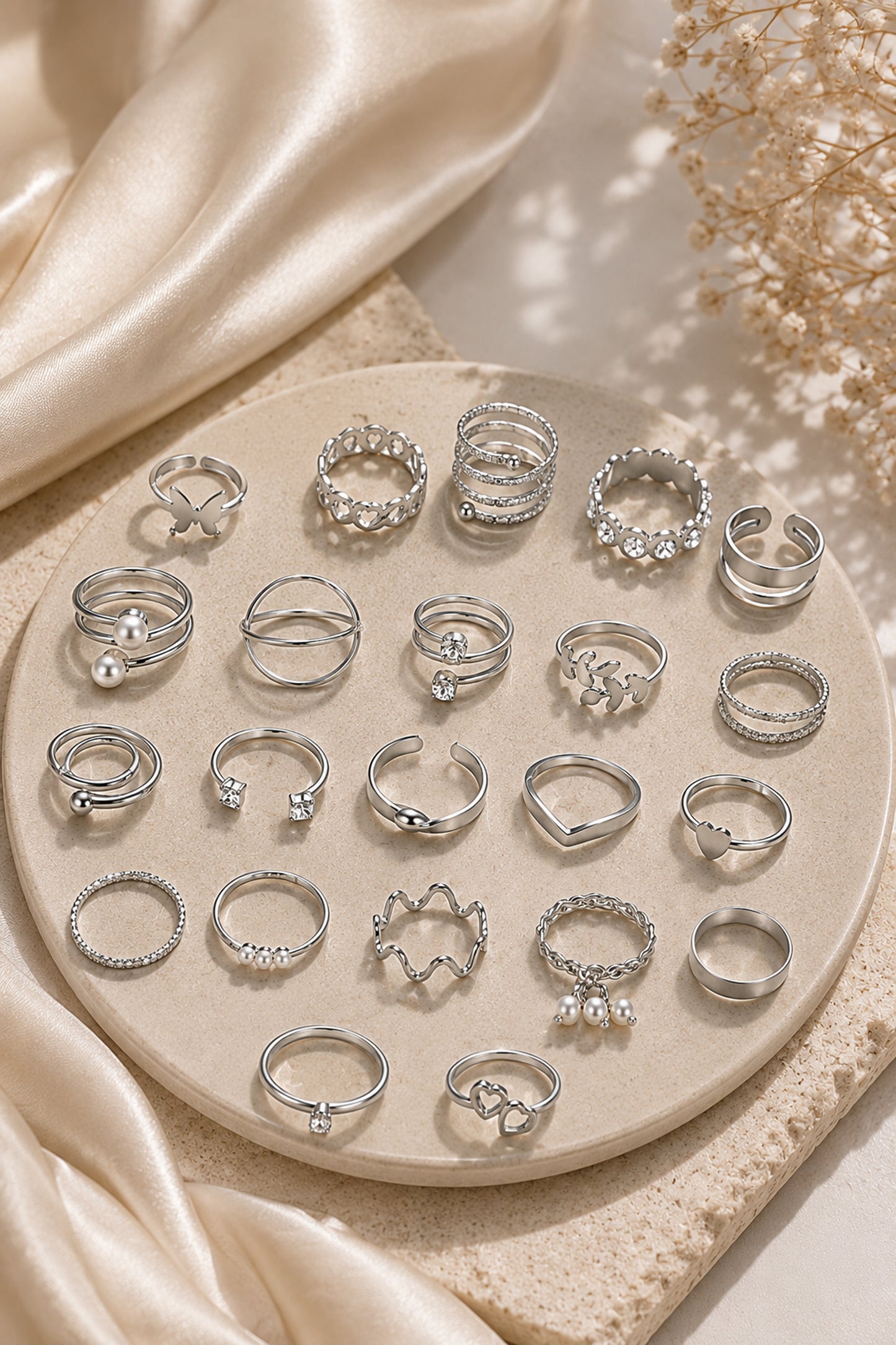 Silver-tone ring set arranged inside a blush velvet tray