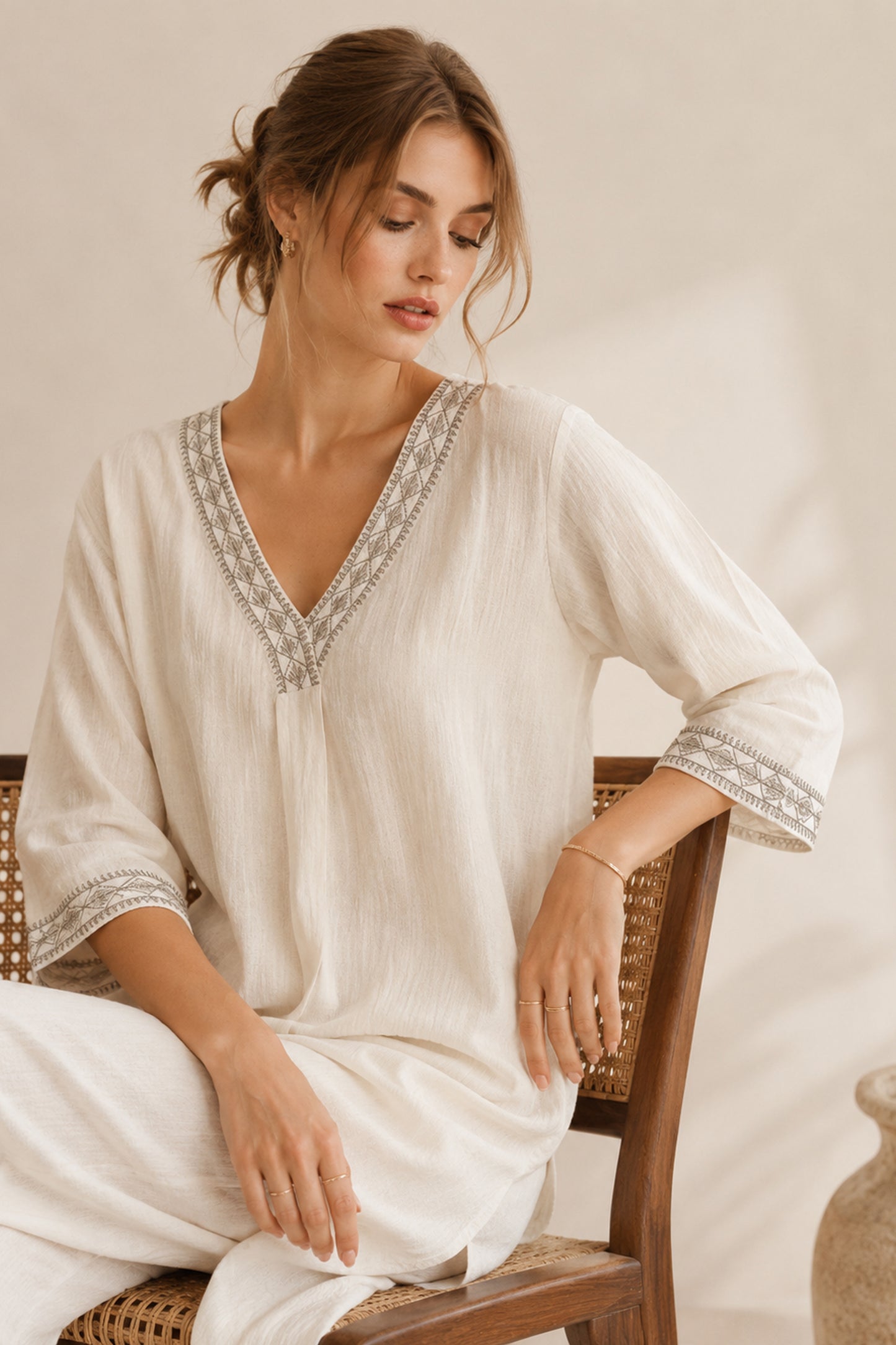 Minimal white kurti styled with wide leg pants