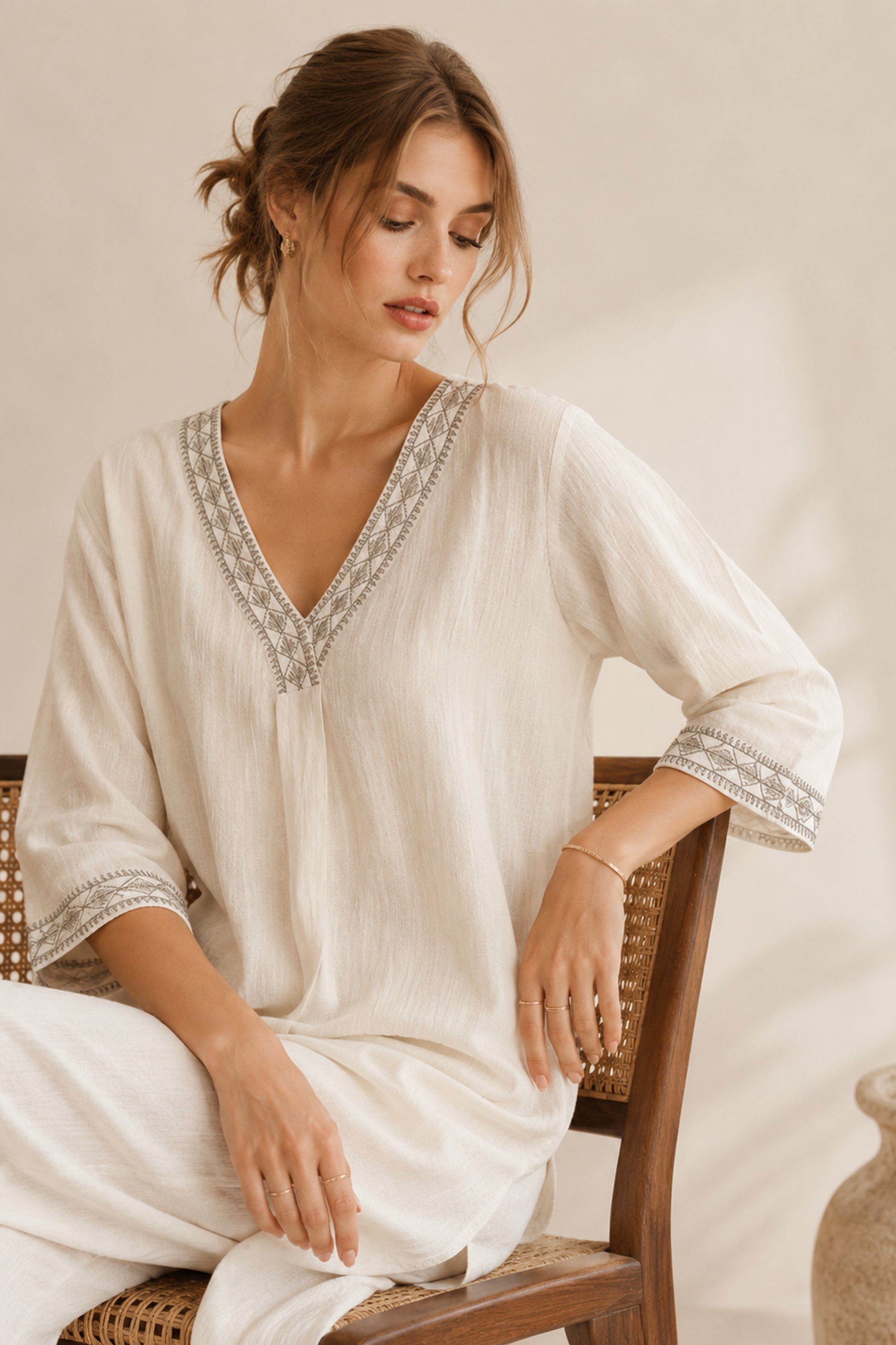 Minimal white kurti styled with wide leg pants