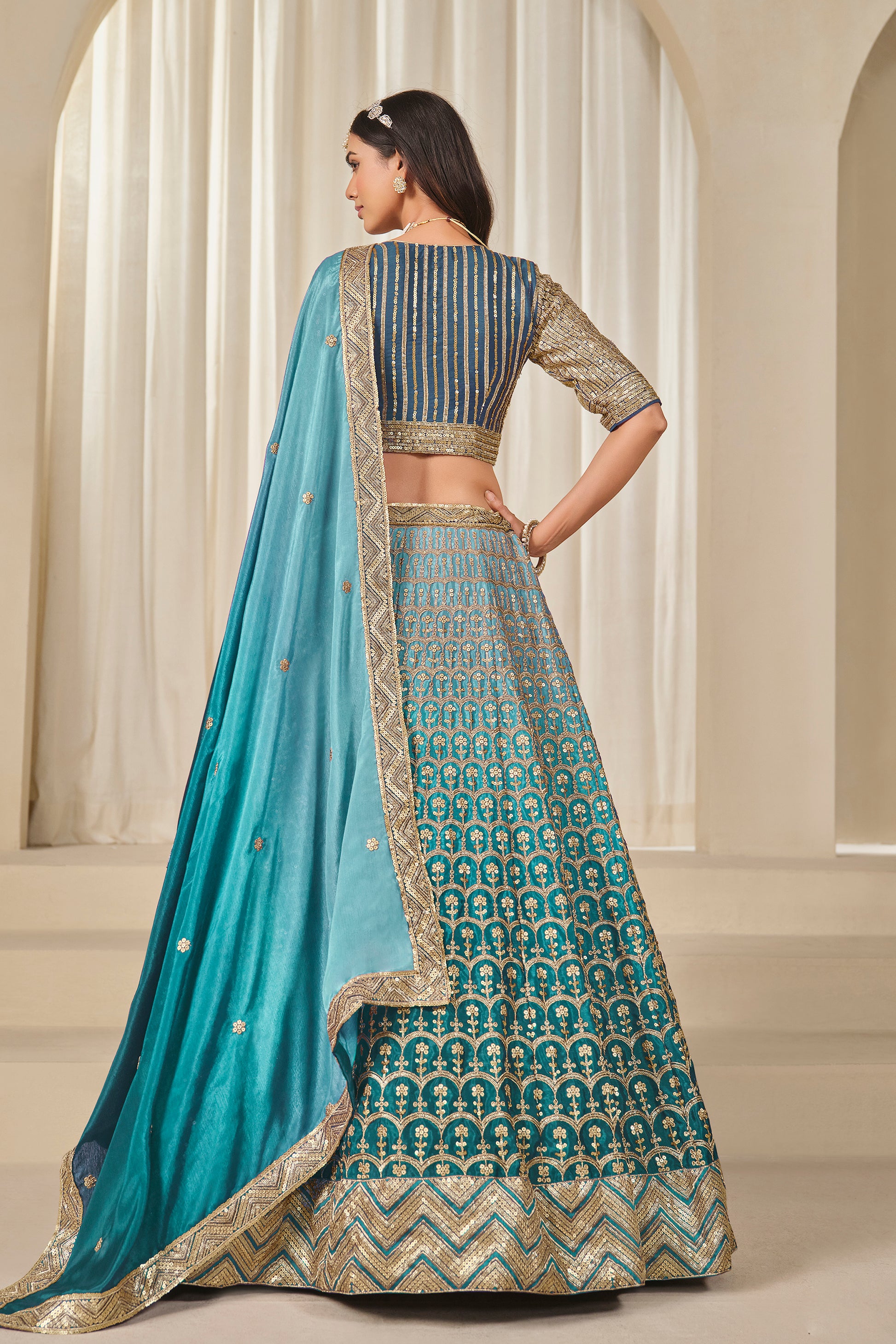 Side angle view of sky blue lehenga choli silhouette