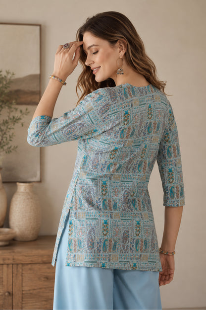 Sky blue tunic styled with wide leg pants