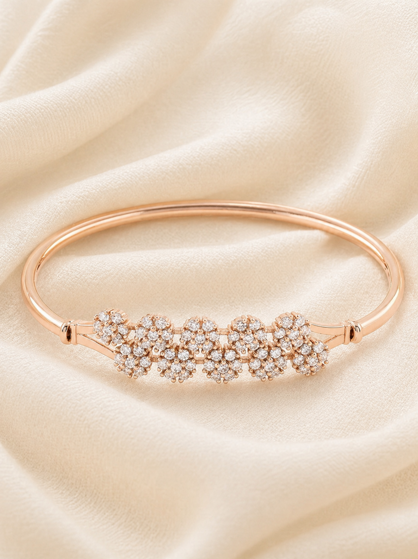 slim metal bracelet with central flower design