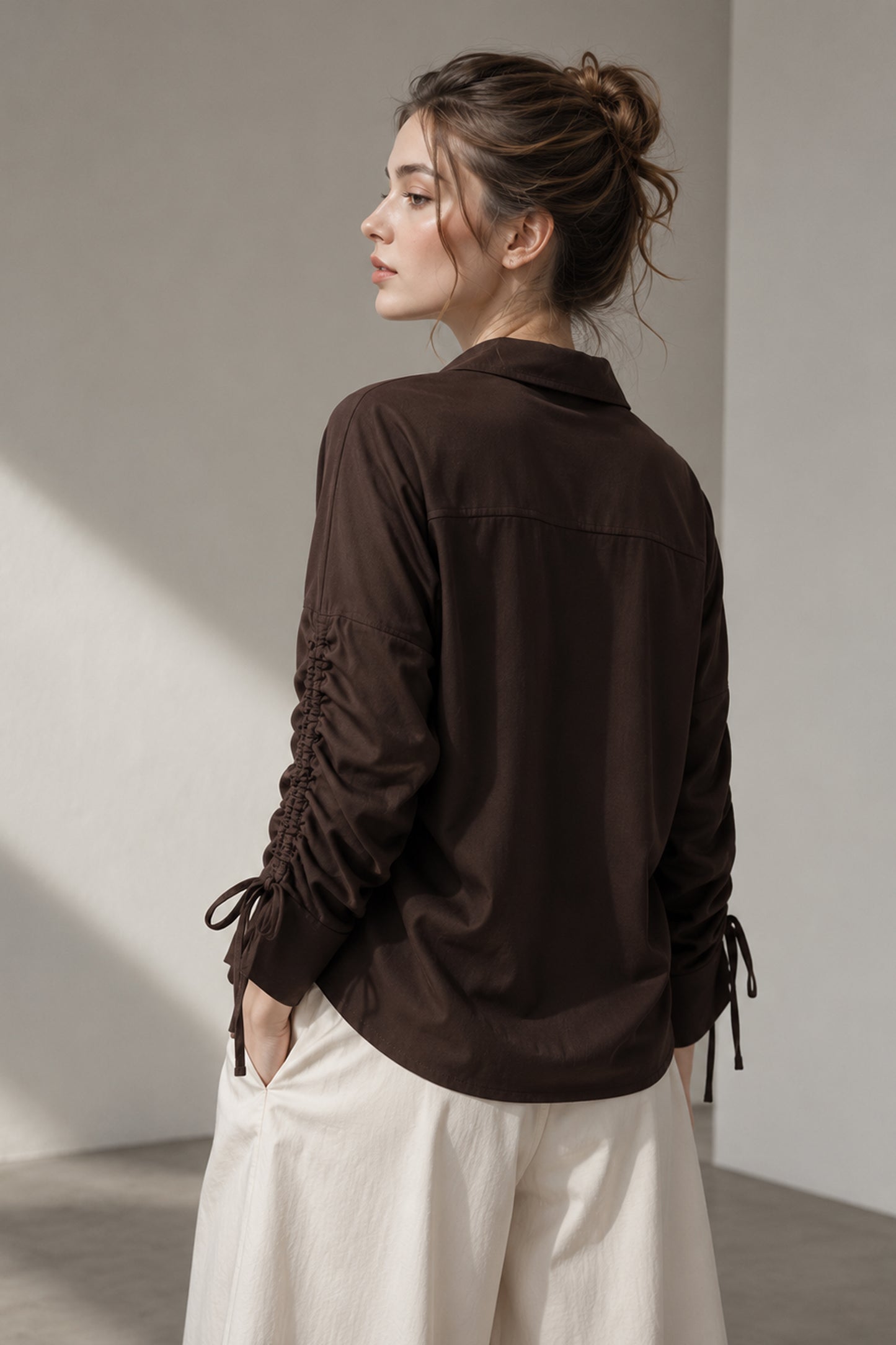 Back view of the Seyuri brown shirt and solid finish