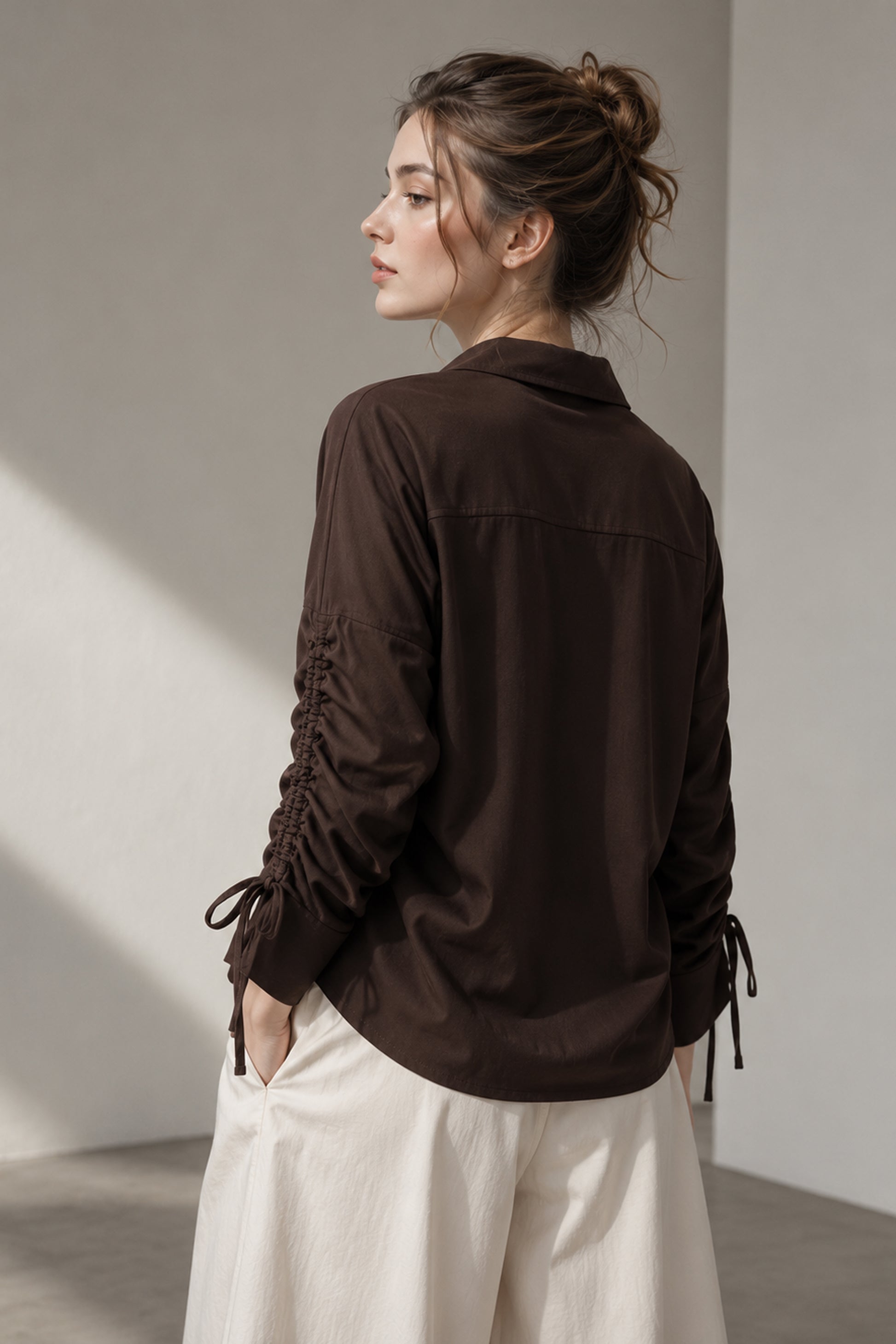 Back view of the Seyuri brown shirt and solid finish