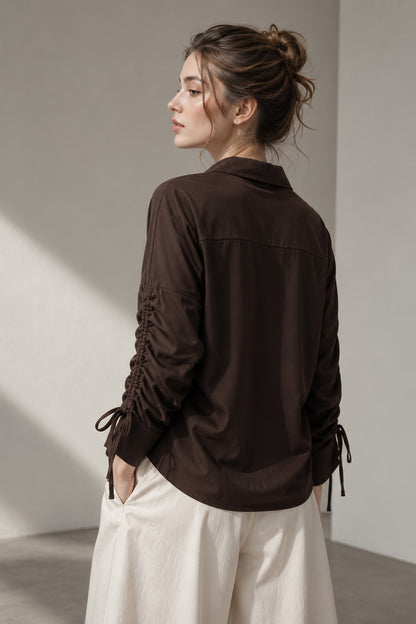 Back view of the Seyuri brown shirt and solid finish