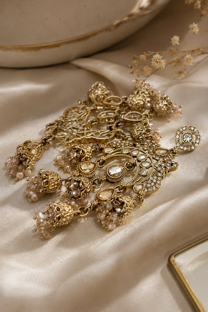 Side angle of statement ethnic drop earrings