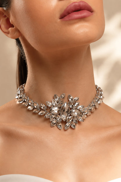 Statement necklace arranged on soft luxury backdrop