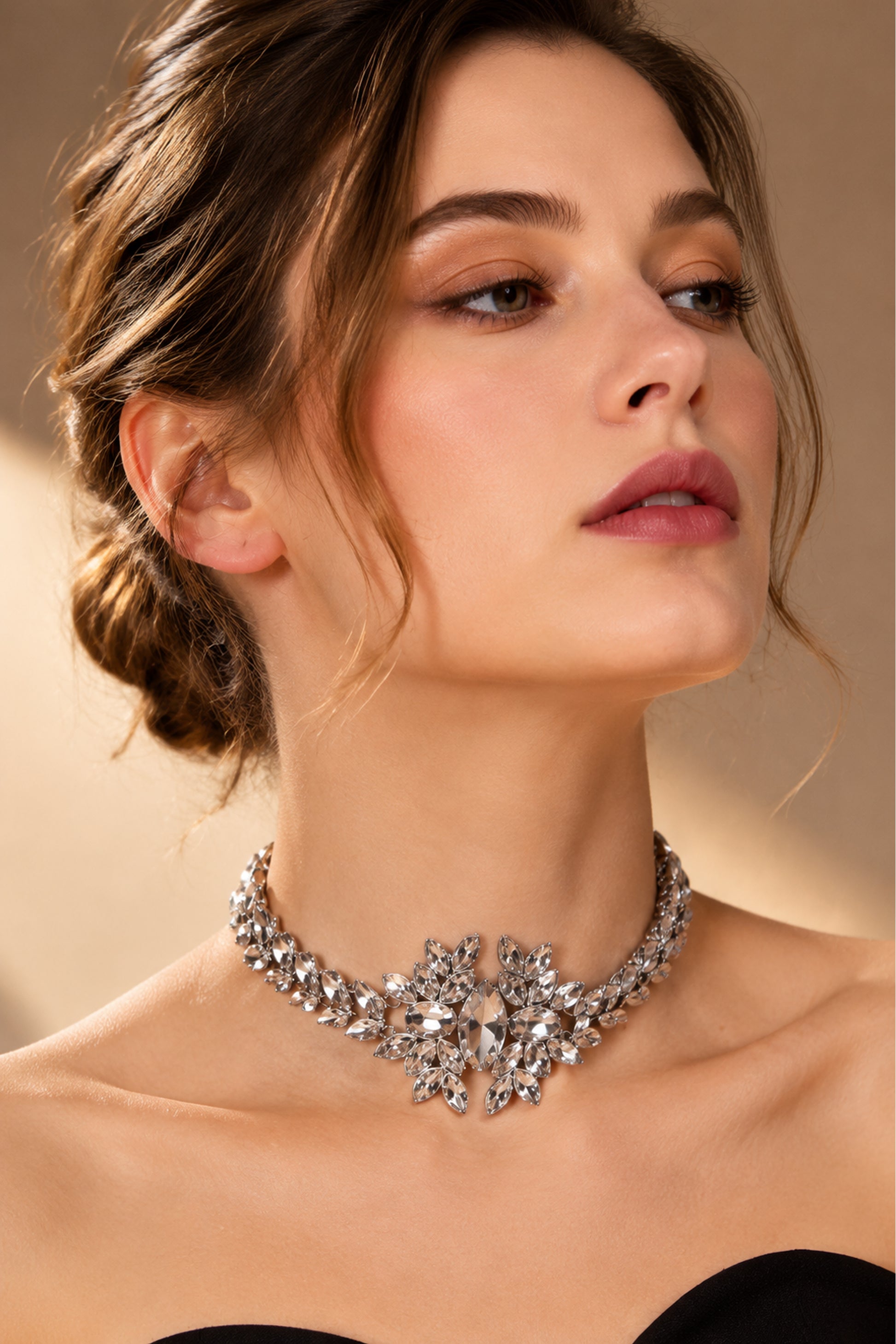 Silver-tone floral necklace showing reflective crystal details
