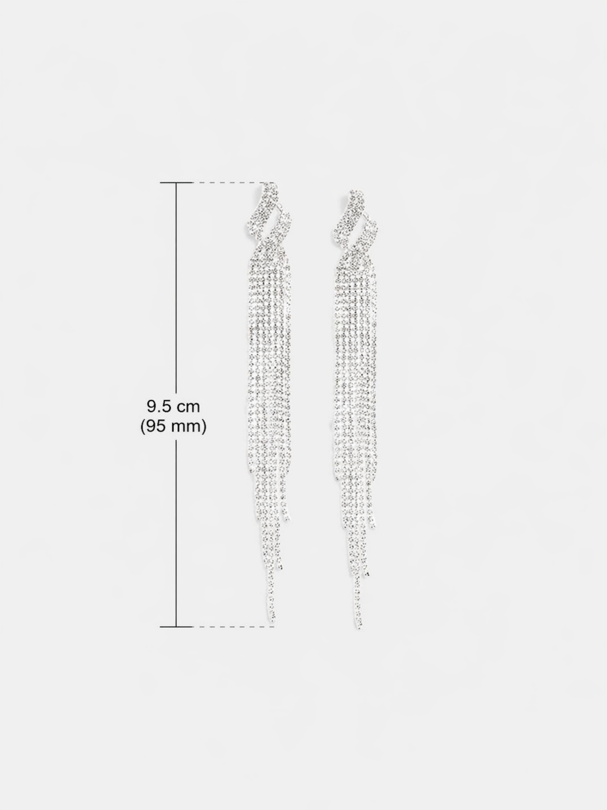 crystal tassel earrings flat lay
