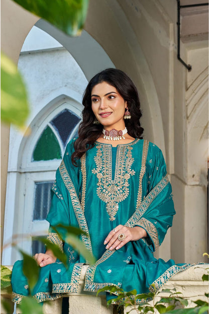 Model wearing teal Palazzo Pants with embroidered detailing