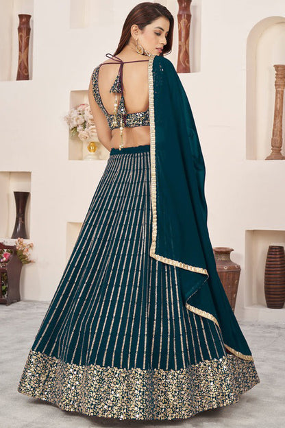 Side angle of teal blue lehenga choli with flowing silhouette