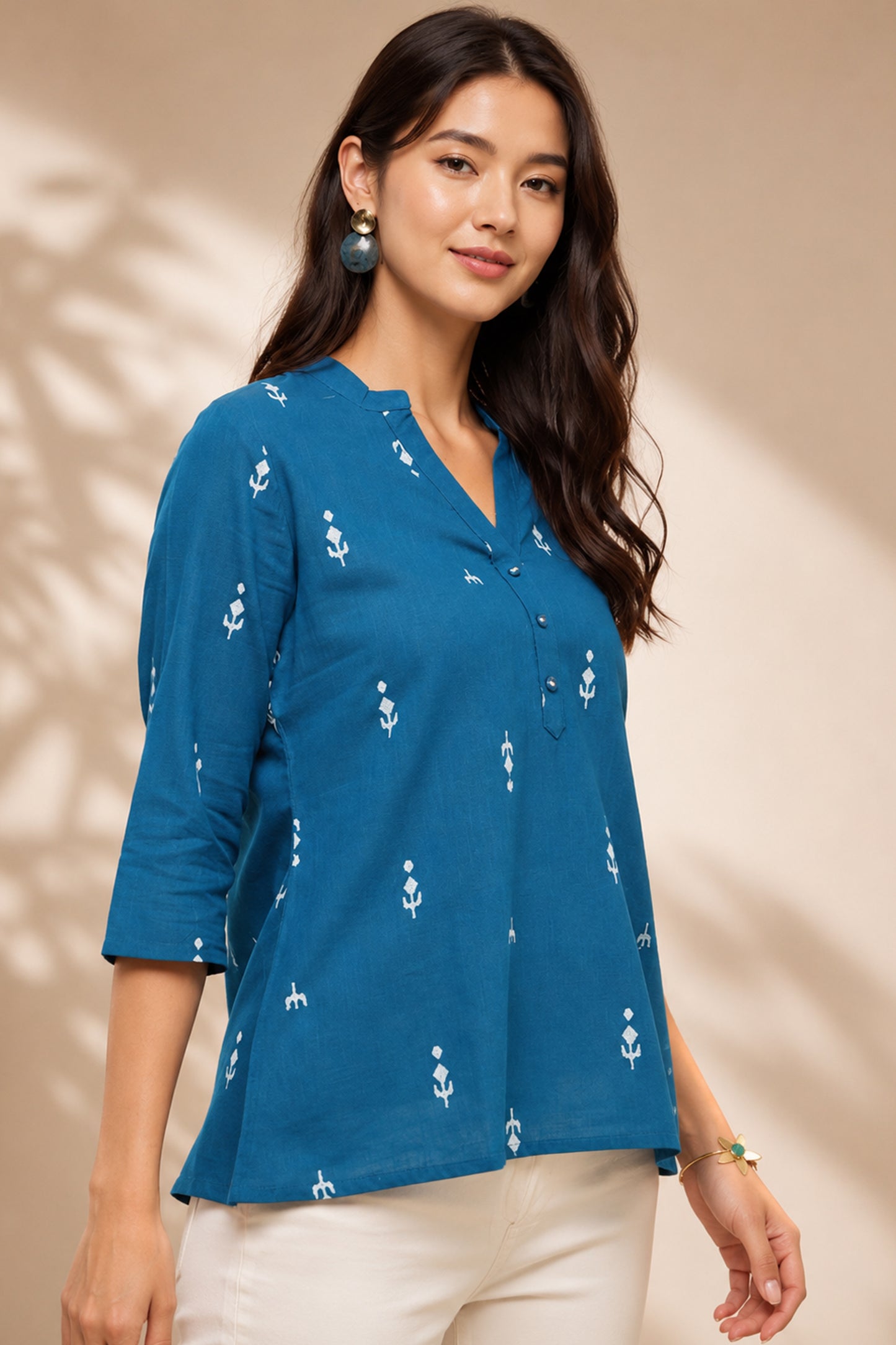 Teal casual tunic paired with everyday bottoms