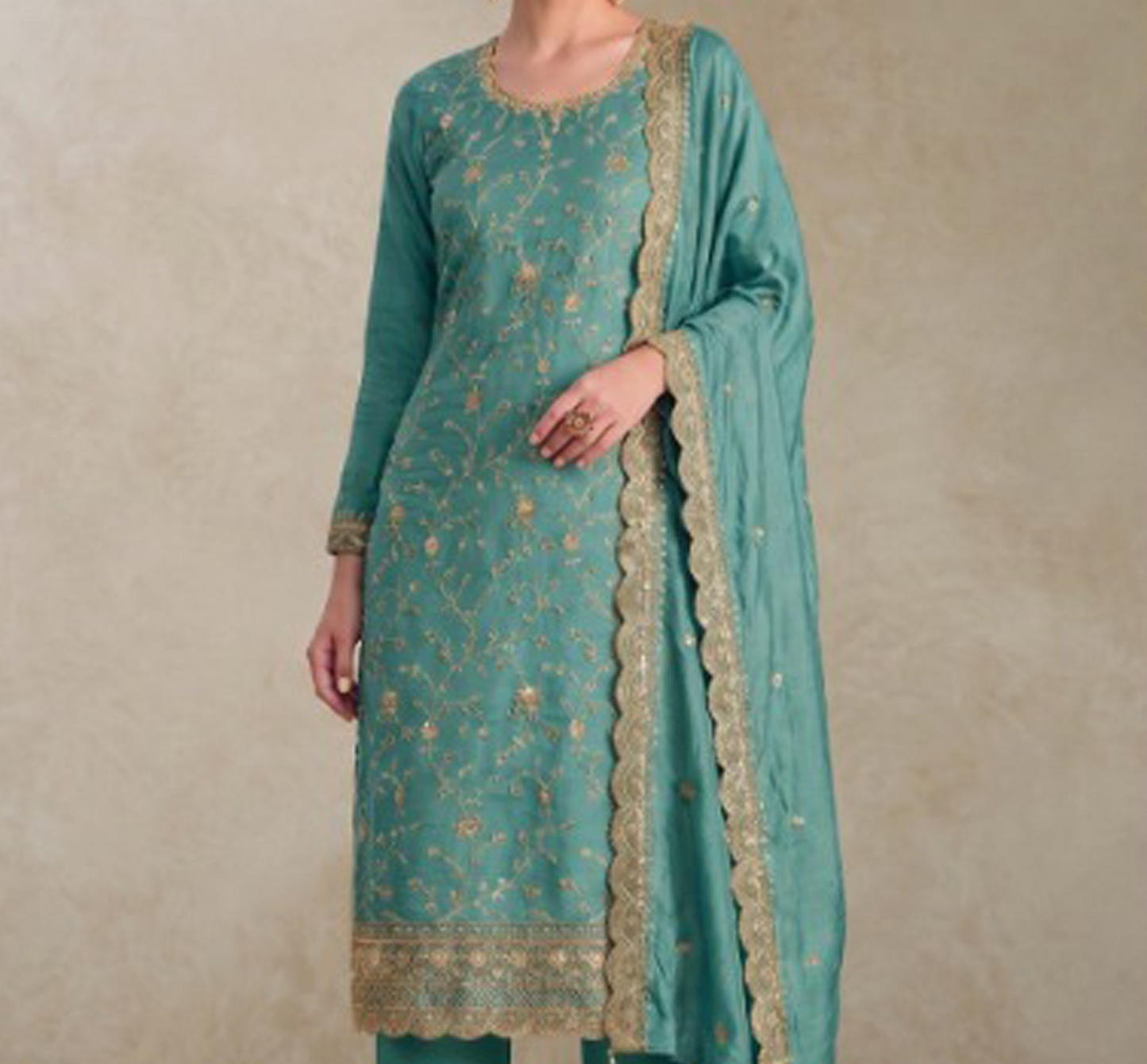 Front view of Dizain Salwar Kameez in teal green shade