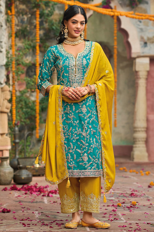 Teal green salwaar kameez front view with heavy embroidery