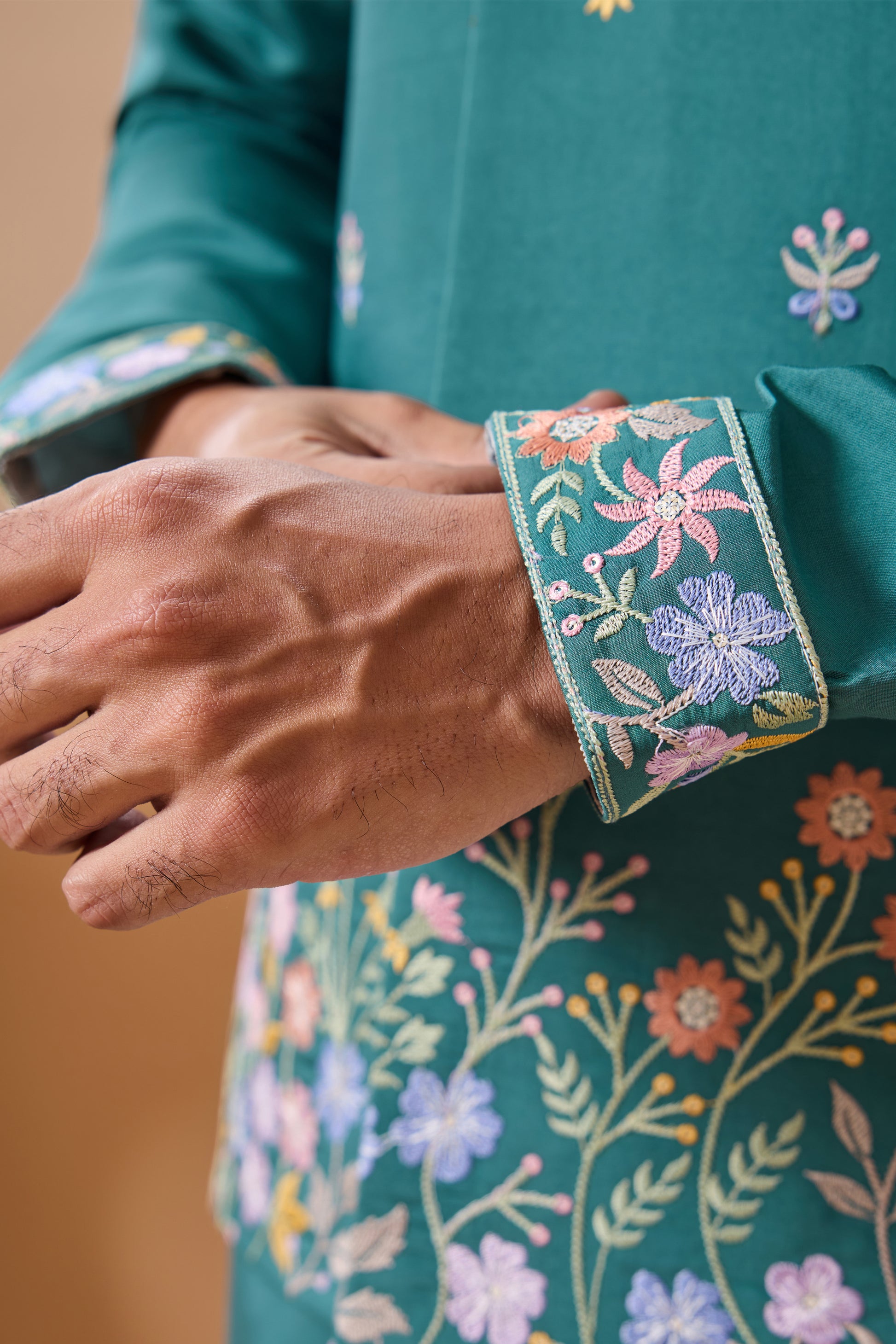 Teal kurta with koti close up of embroidery craftsmanship
