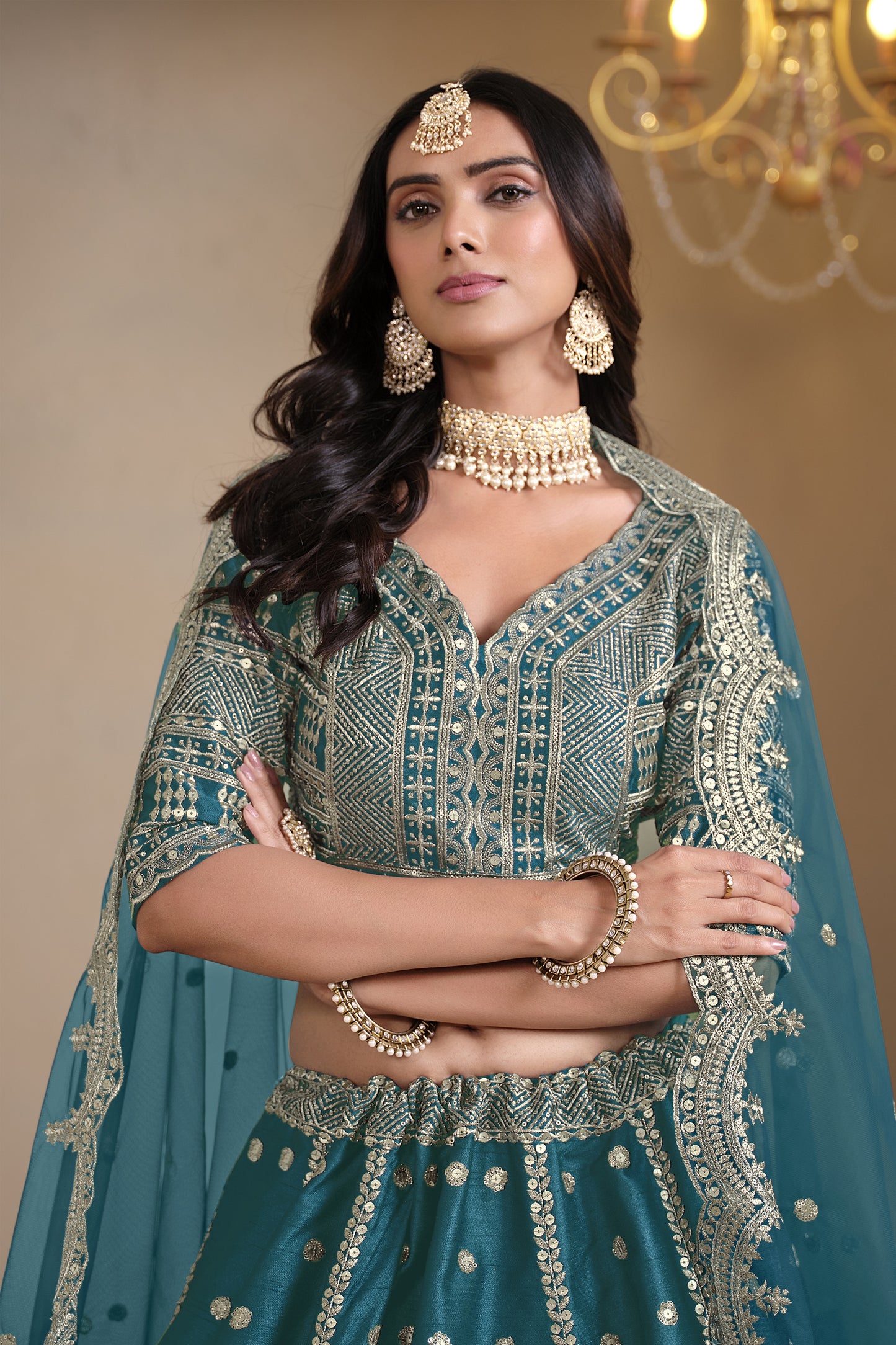 teal color lehenga styled for wedding evening event