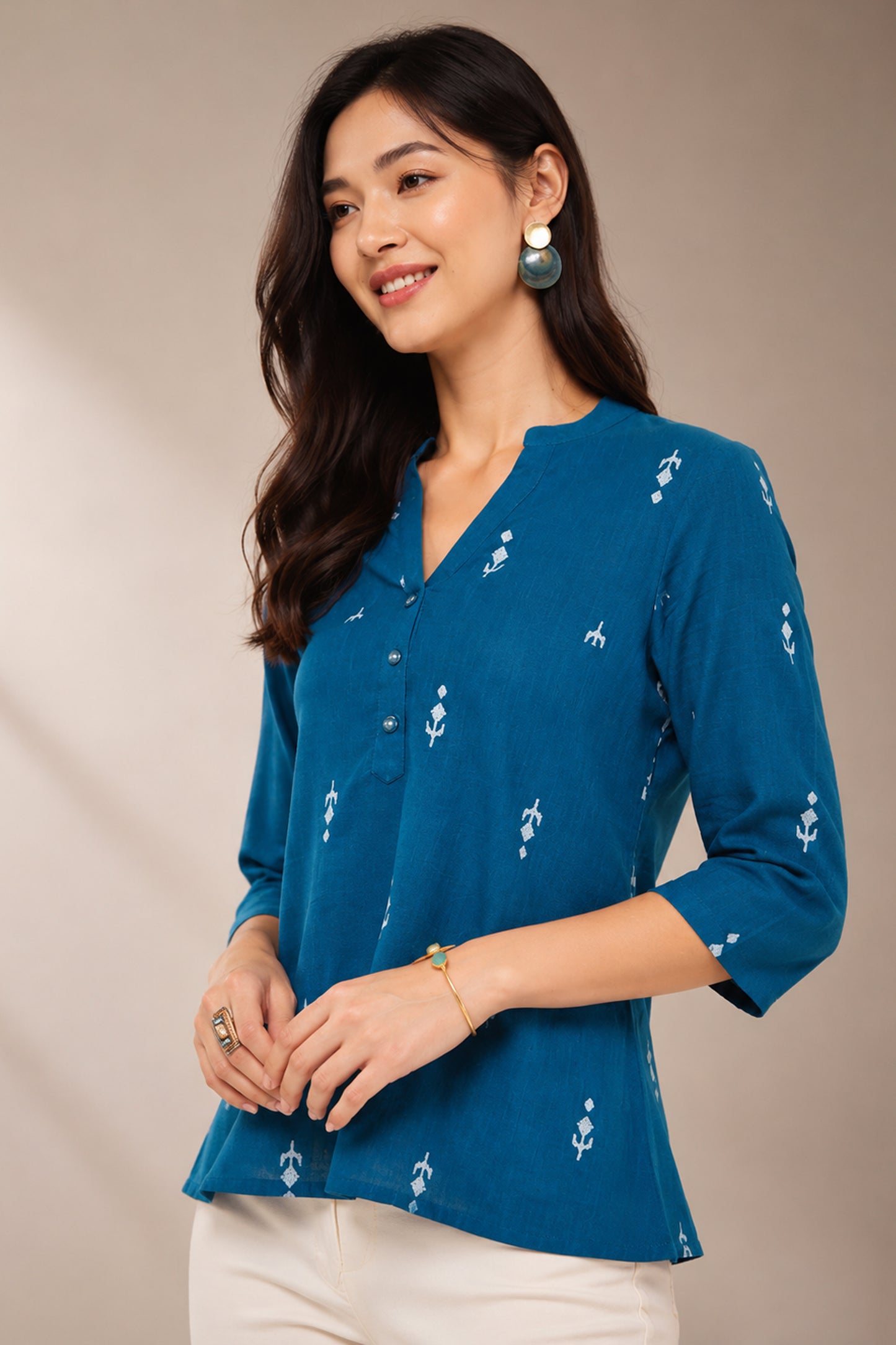 Side profile of teal printed cotton tunic