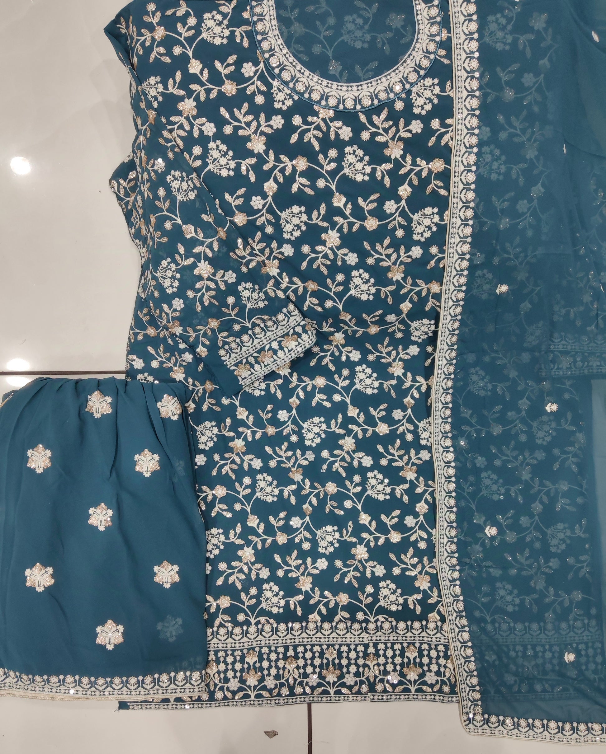 Close-up of festive embroidery on kameez top