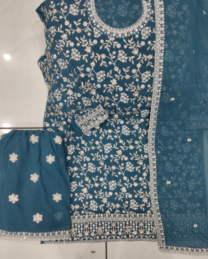Close-up of festive embroidery on kameez top