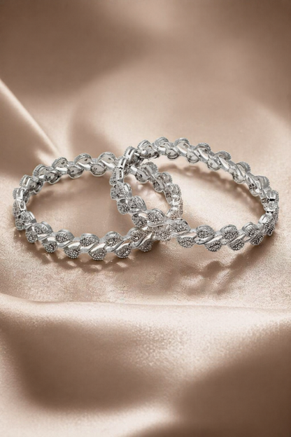 polished silver finish bangles with repeating pattern