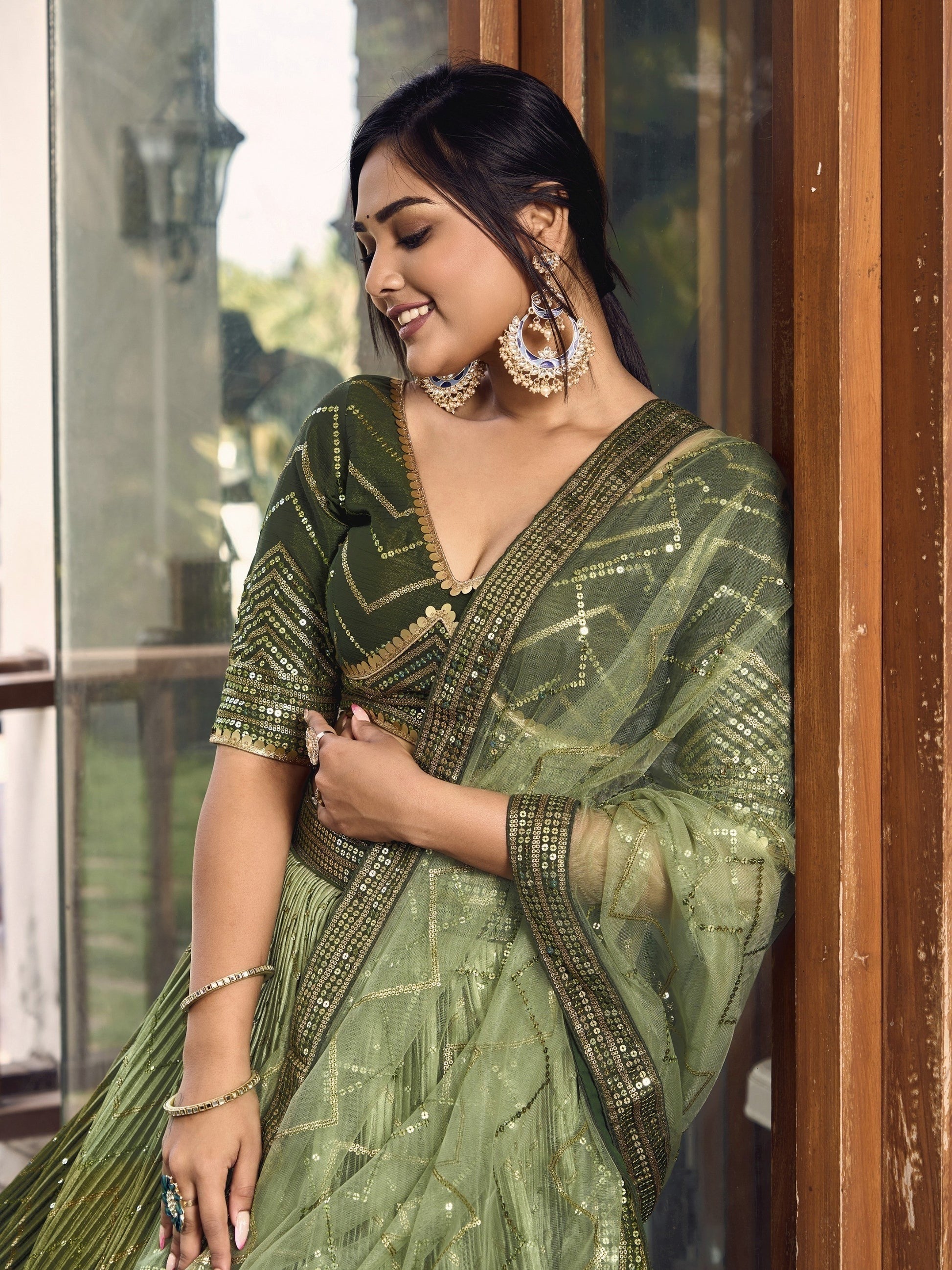 close-up of thread embroidery on pistachio green skirt