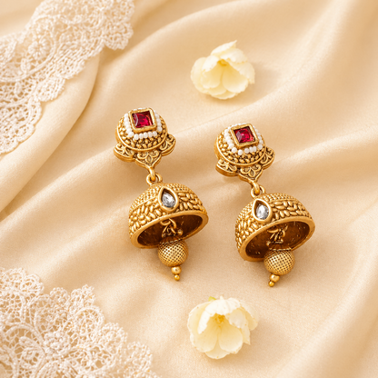 Detailed gold-tone necklace and jhumka earring set