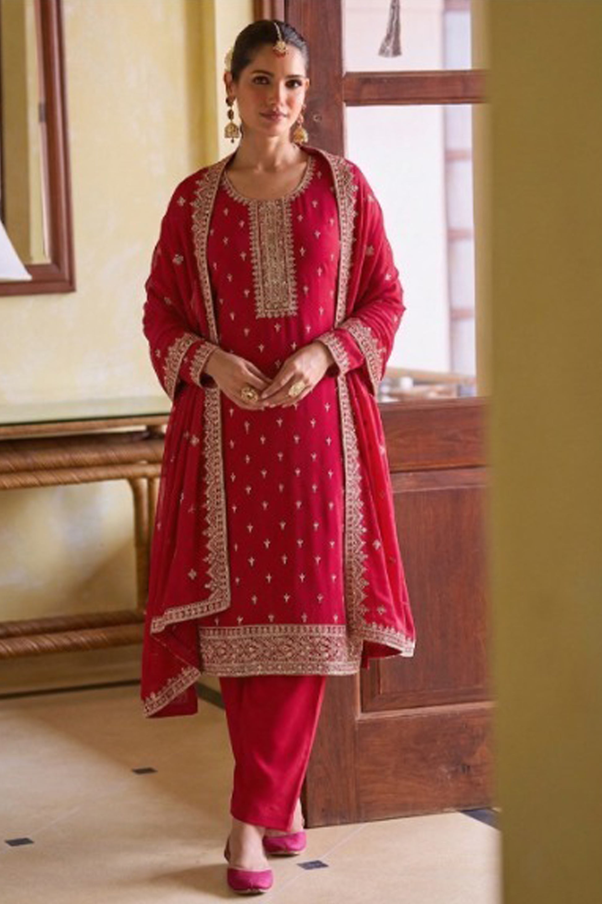 Traditional embroidery work on red georgette outfit
