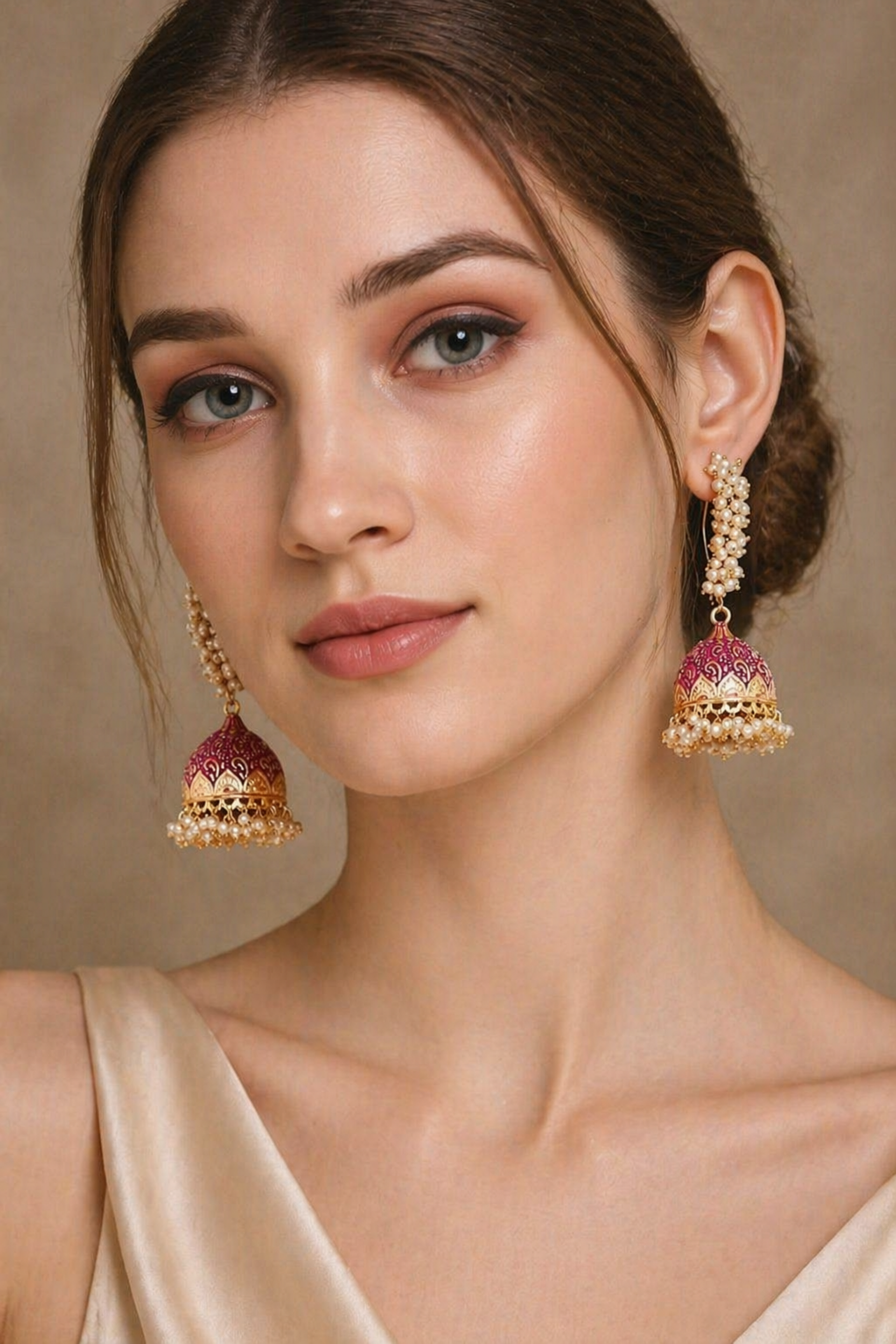 gold jhumka earrings with pearl cluster detail
