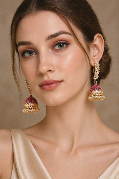 gold jhumka earrings with pearl cluster detail
