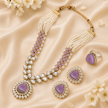 Traditional purple kundan necklace set laid on satin fabric