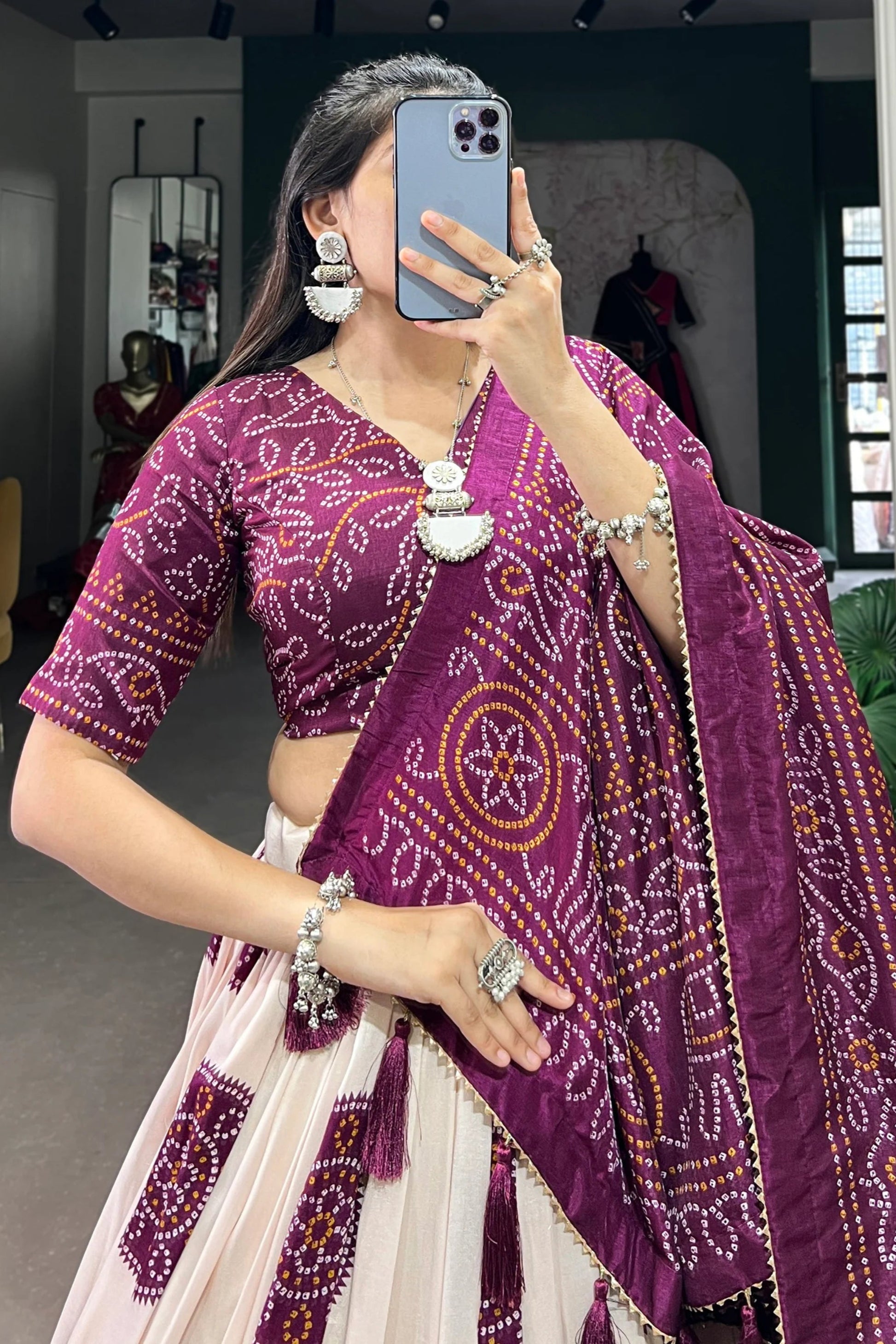 Close-up of digital print work on purple lehenga