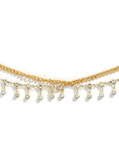 gold tone waist chain flat lay with extension chain