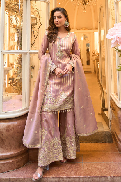 Full-length view of soft pink palazzo trousers outfit