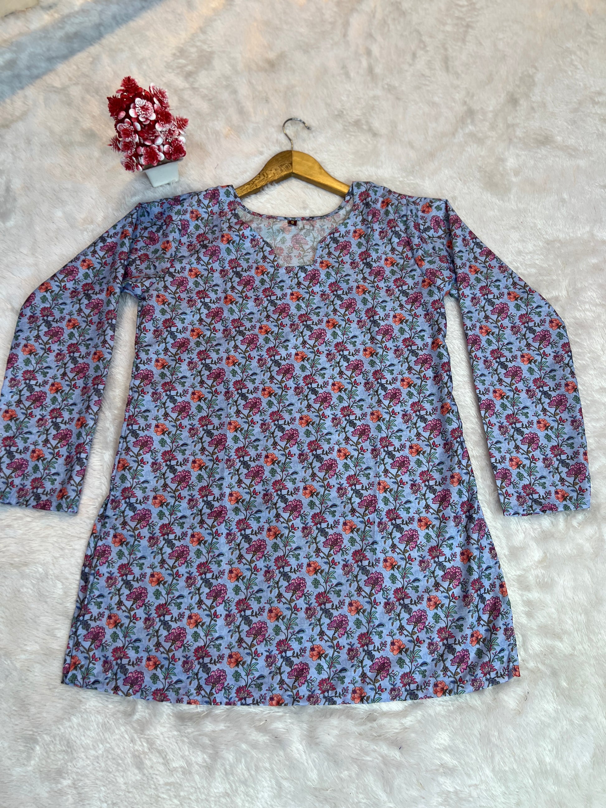 Casual weekend outfit featuring blue women’s tunic top