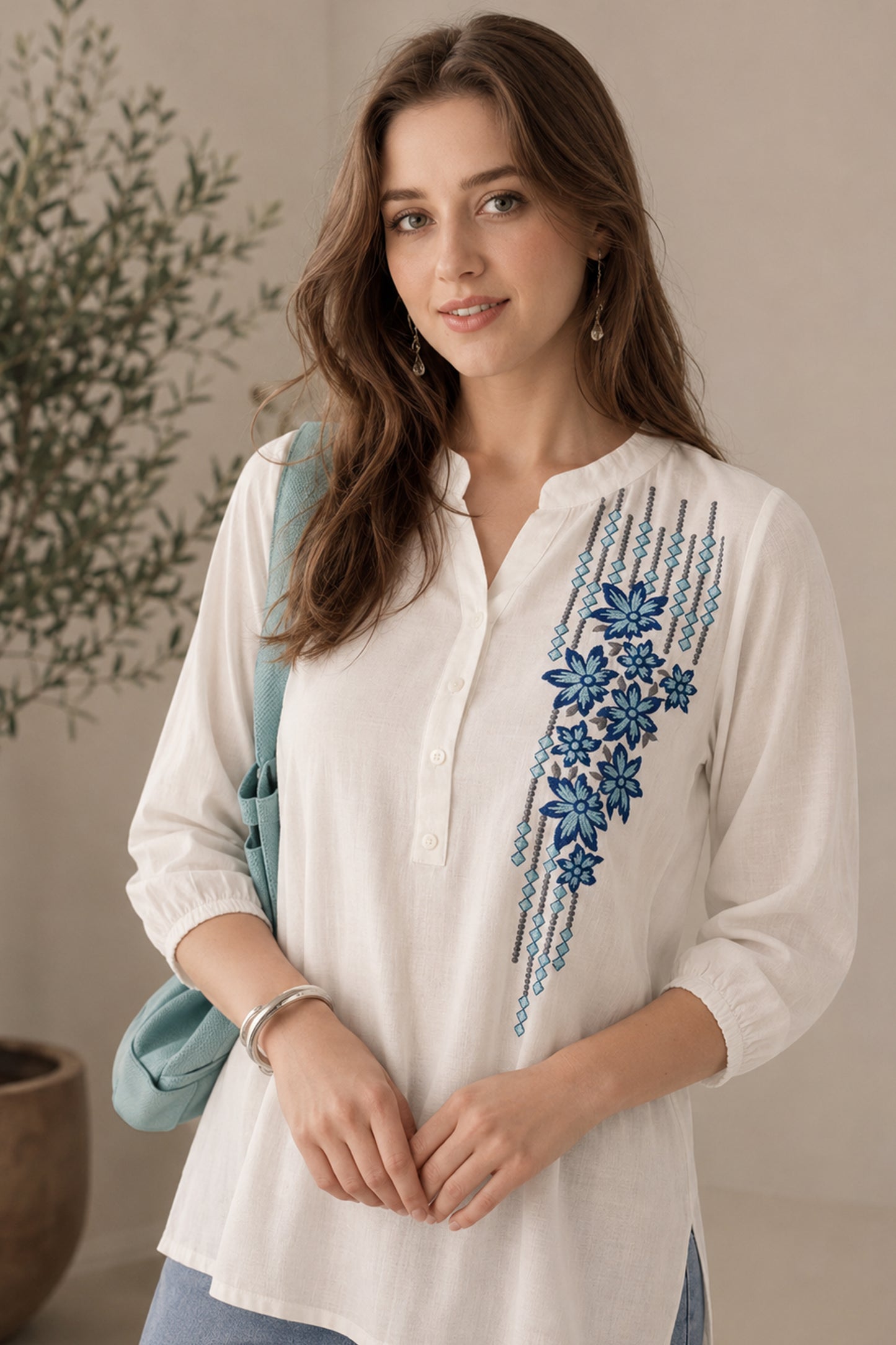 White tunic with blue floral embroidered front panel