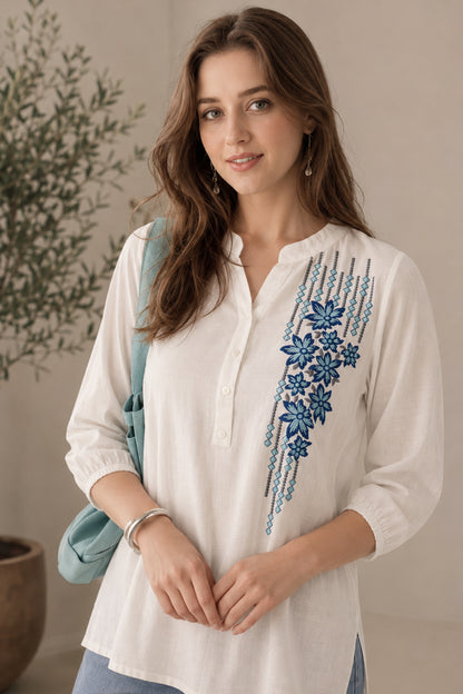 White tunic with blue floral embroidered front panel