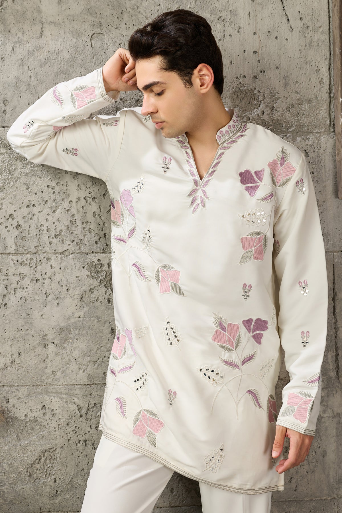Hem detail of the white kurta with embroidery