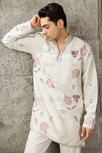 Hem detail of the white kurta with embroidery