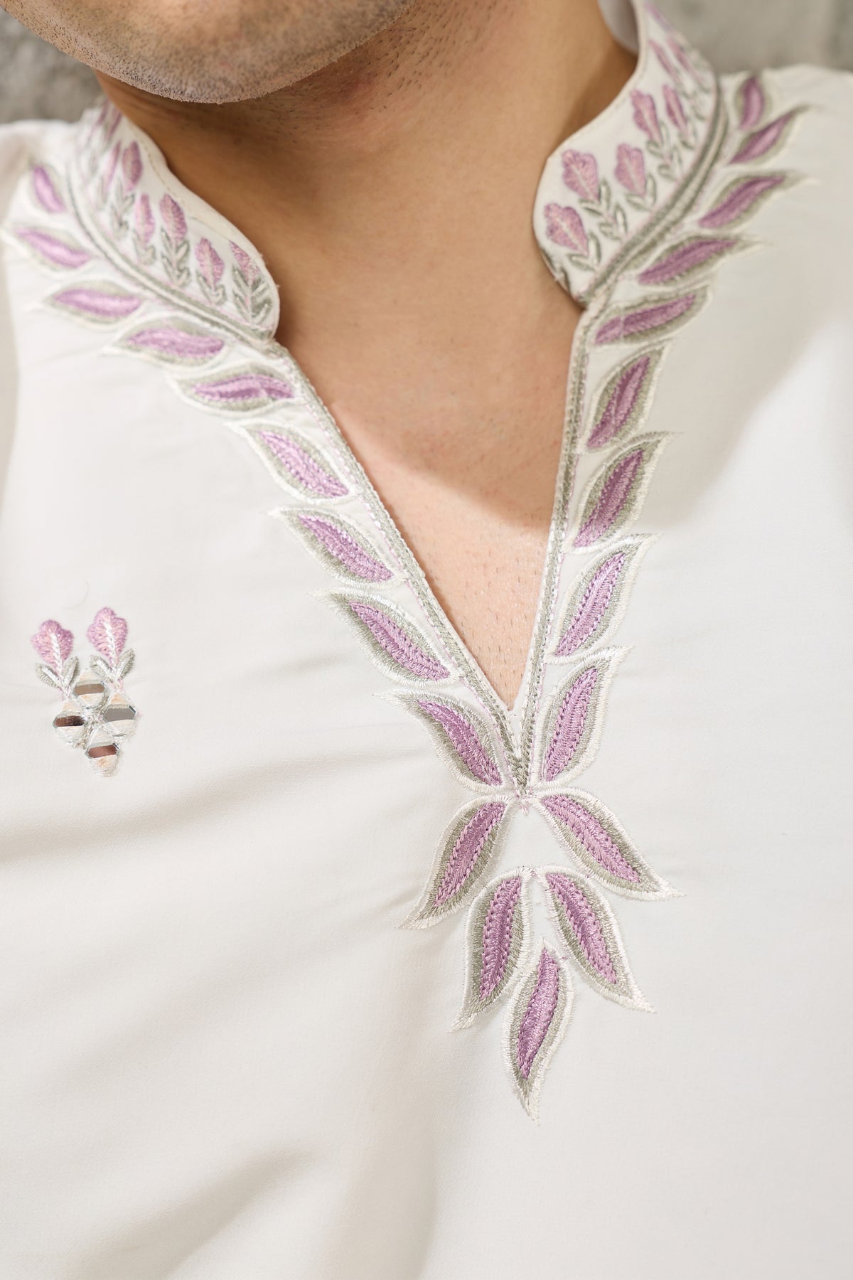 Front neckline detail of the white embroidered kurta