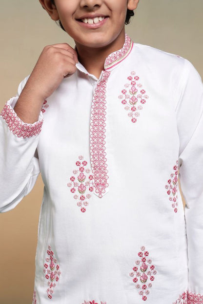 close up of sequence embroidered work on white kurta