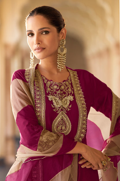 Close up of embroidery work on wine kameez