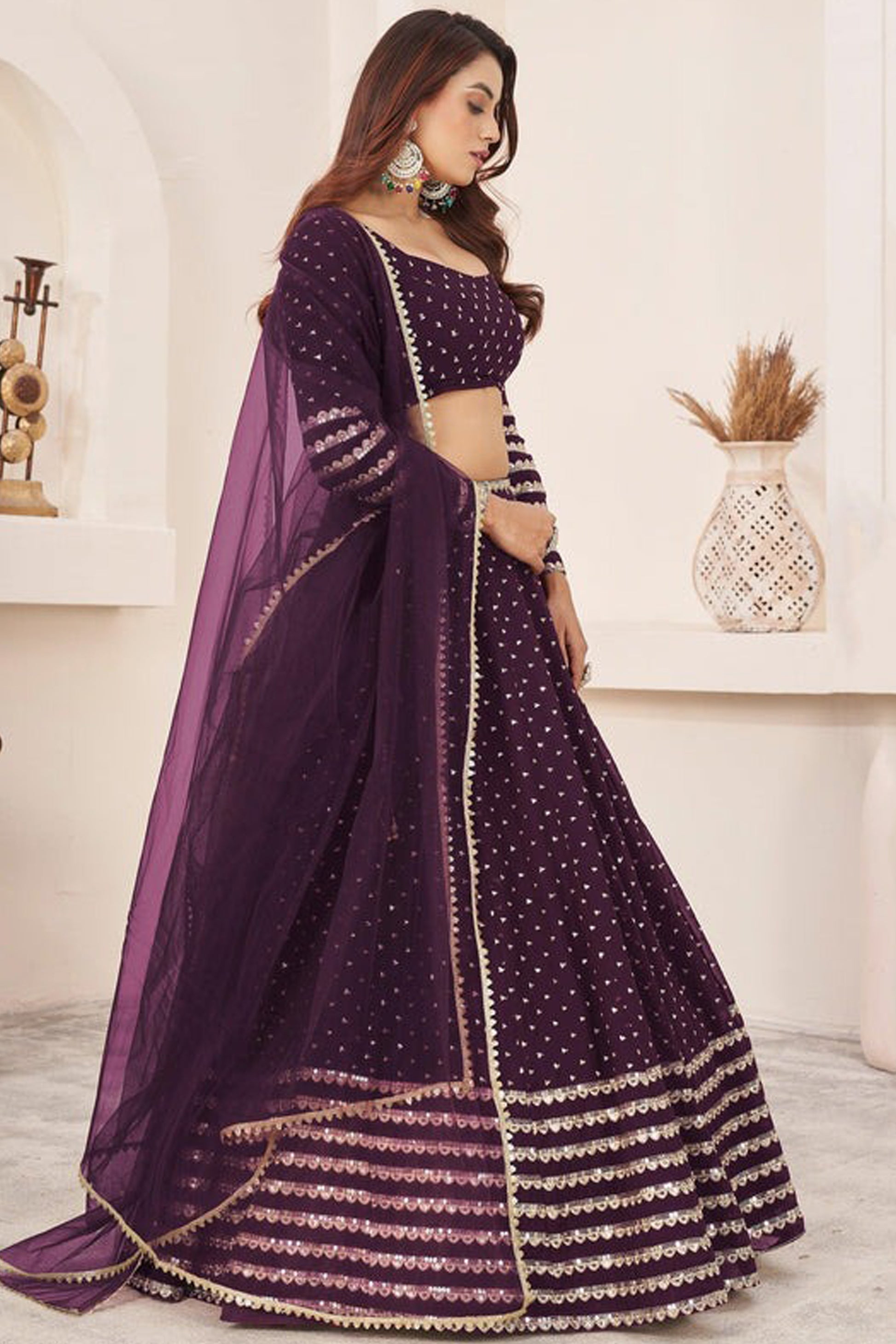 reception outfit styling with wine lehenga choli