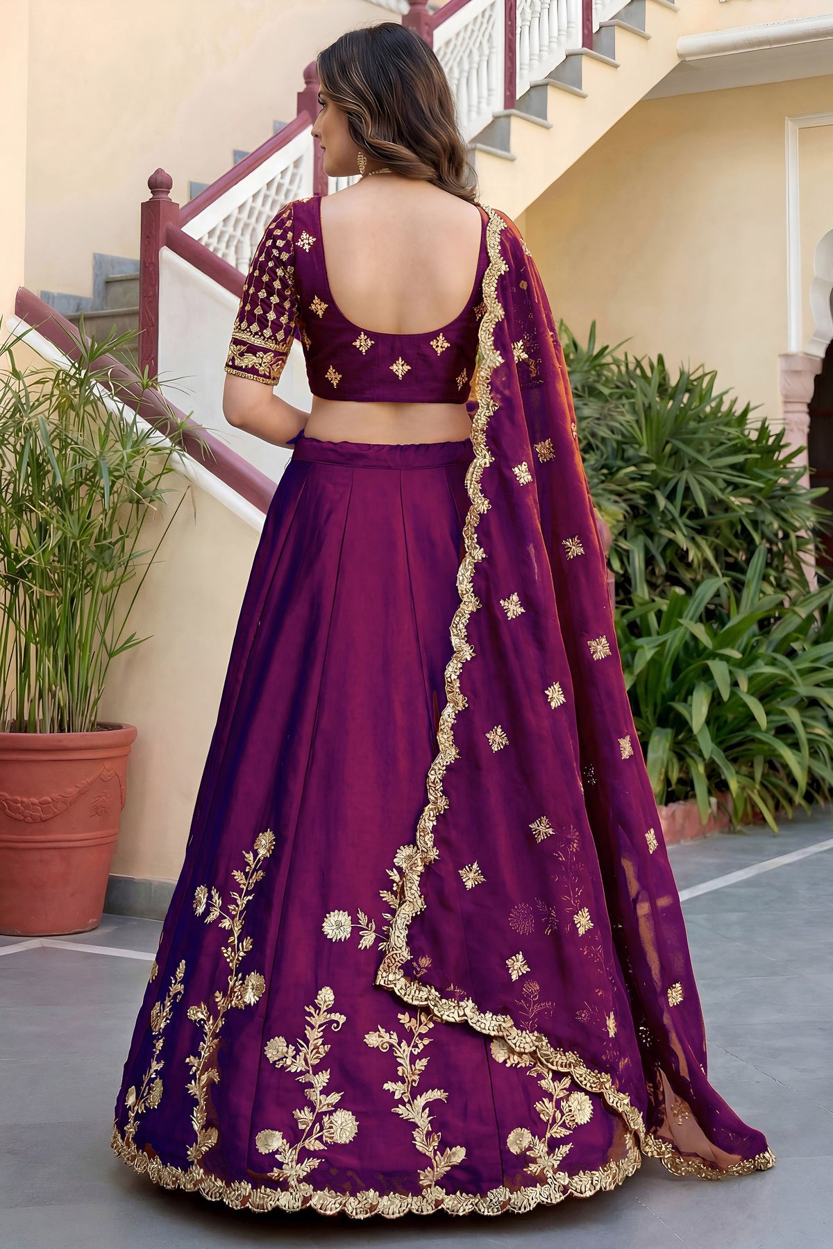 Wine lehenga choli back view showing dupatta drape