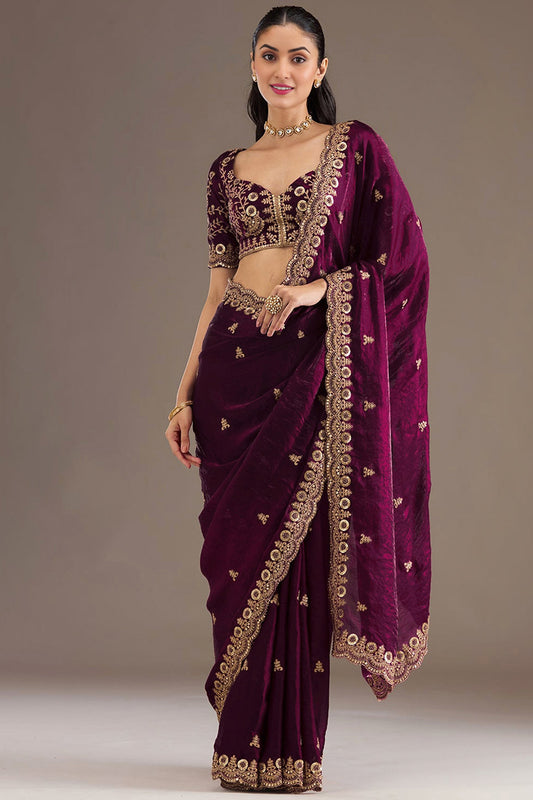 Heavy Zari And Embroidery detailing on wine saree pallu
