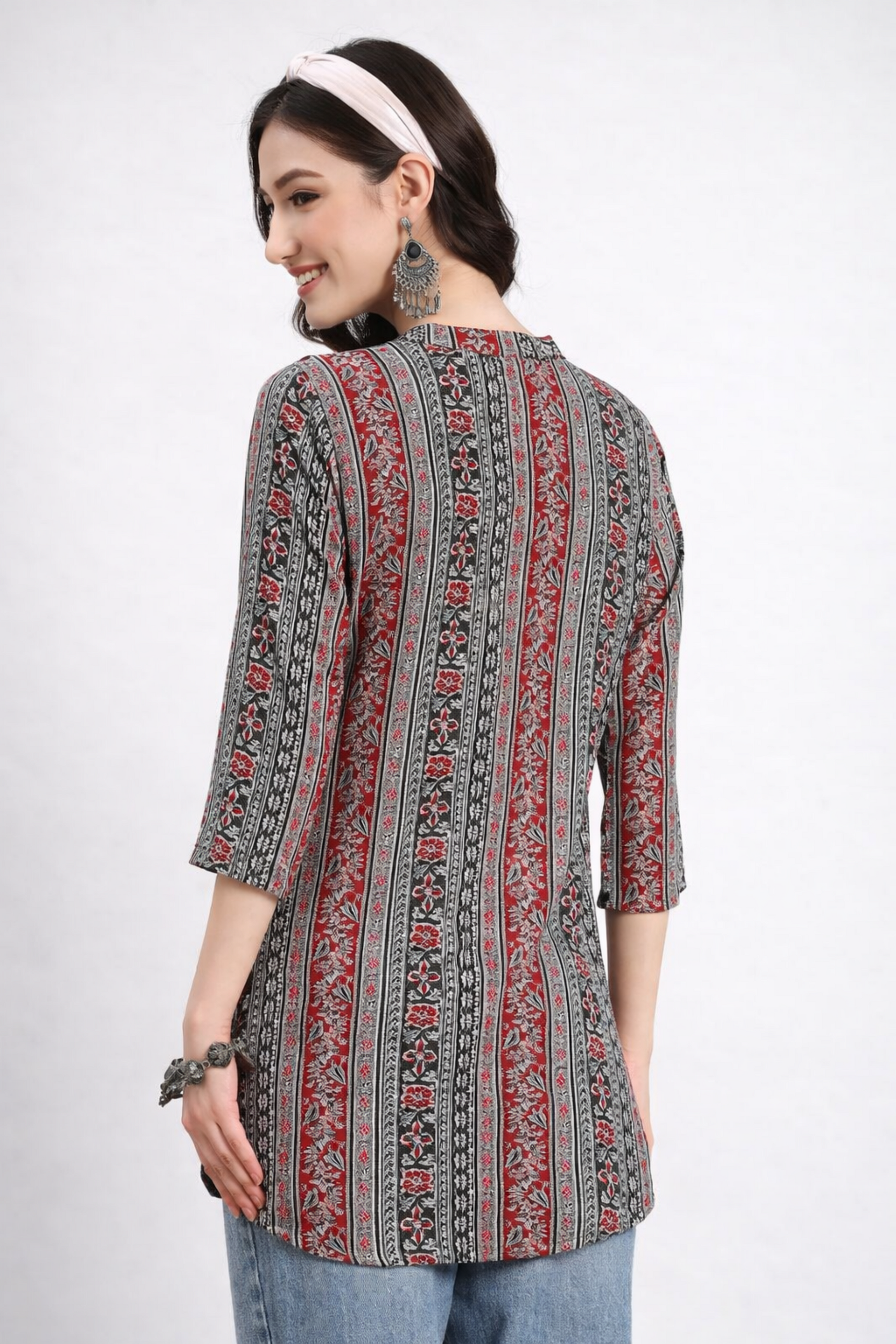 Floral design detail on multicolor tunic top