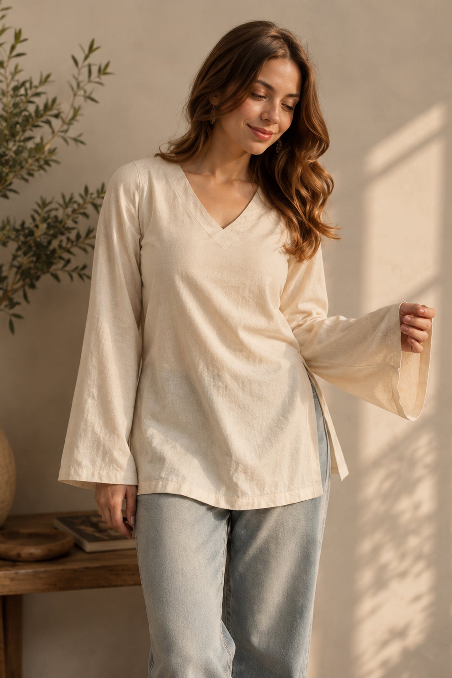 Cream tunic top paired with casual daily outfit